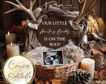 May include: A rustic wooden sign with the text "Our Little Hunting Buddy Is On The Way!" surrounded by antlers, candles, and a faux fur nest with an ultrasound image. The sign is brown with white text. The antlers are light brown. The candles are white. The faux fur is light brown. The ultrasound image is black and white.