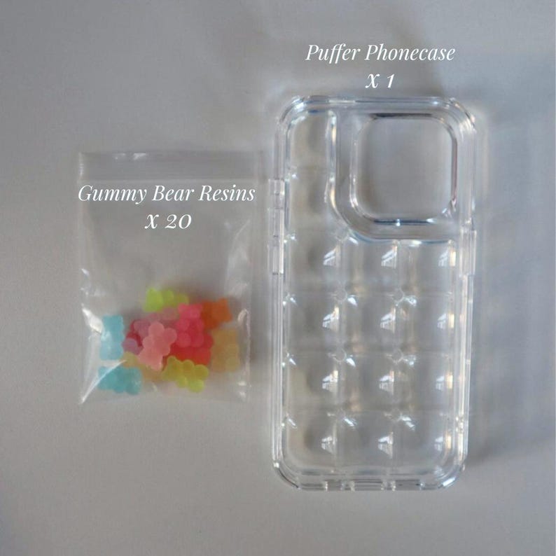May include: A clear, textured phone case and a small bag of colorful gummy bear resins. The phone case is labeled "Puffer Phonecase X 1" and the bag is labeled "Gummy Bear Resins X 20". The gummy bears are various colors.