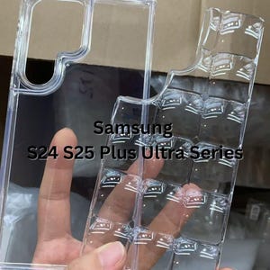 May include: Clear, transparent phone case for Samsung S24, S25 Plus, and Ultra Series models. The case is made of a clear material and features a grid-like design on the back. The case is held by a hand.