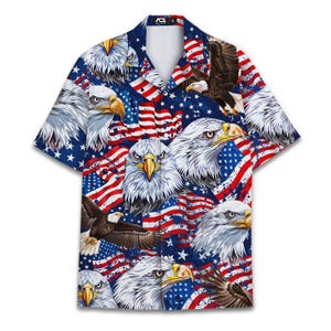 May include: Short-sleeved button-down shirt featuring a patriotic design. The shirt showcases a repeating pattern of bald eagles, American flags, and stars on a blue background. The collar and button placket are navy blue.