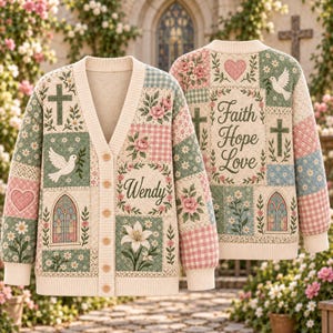 May include: A cream-colored knit cardigan featuring a patchwork design with floral patterns, gingham squares, crosses, doves, hearts, and stained-glass windows. The front displays the name Wendy, while the back features the text Faith Hope Love.