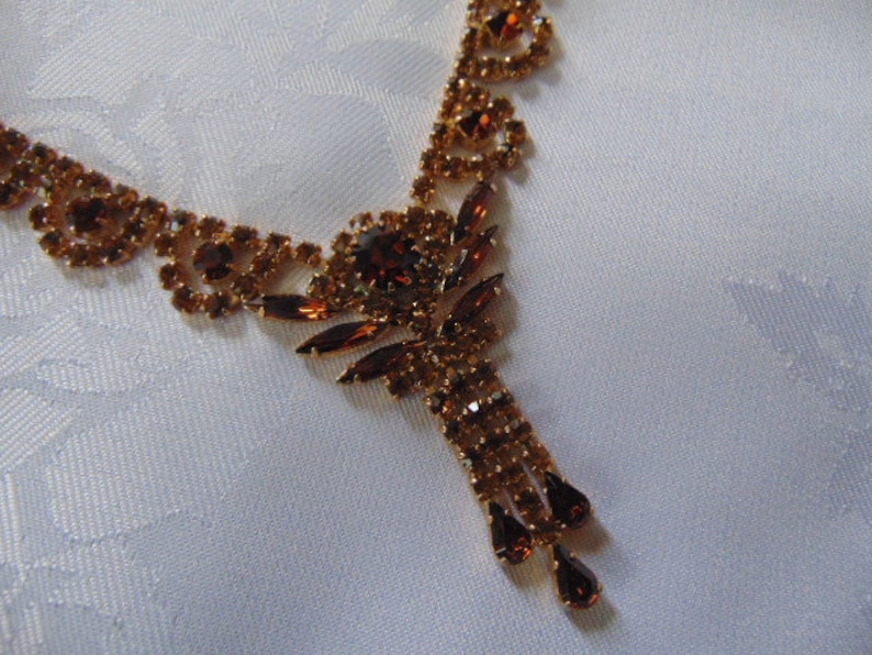 stunning deep amber coloured rhinestone necklace 16 inches long plus the drop tassel