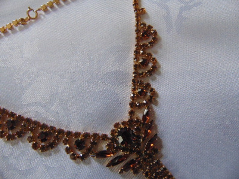 stunning deep amber coloured rhinestone necklace 16 inches long plus the drop tassel
