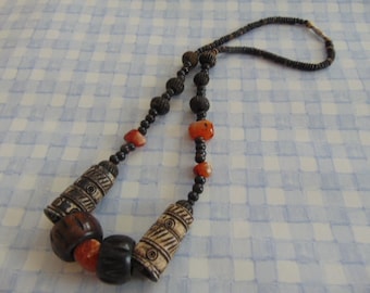 Stunning tribal looking necklace large beads shades of cream and brown 23" long
