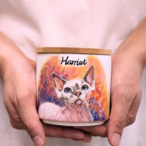Hand-painted ceramic pet memorial urn, custom realistic portrait
