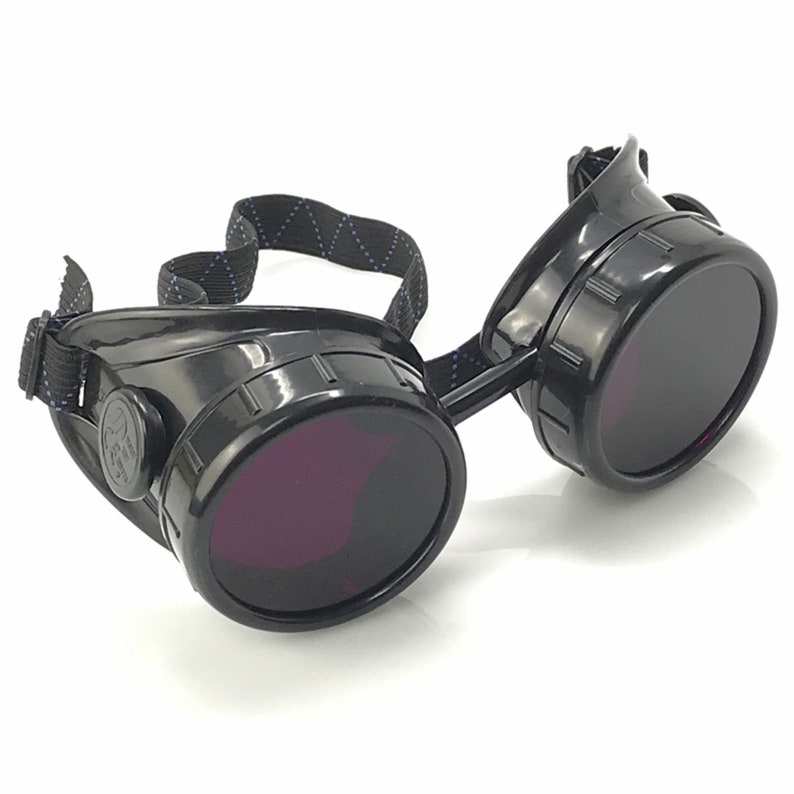 May include: Black steampunk-style goggles with round, dark lenses and a black adjustable strap.