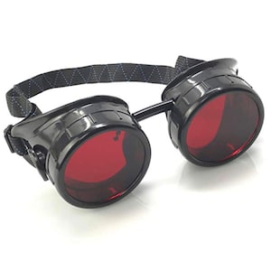 May include: Black steampunk-style goggles with red lenses and a black adjustable strap.