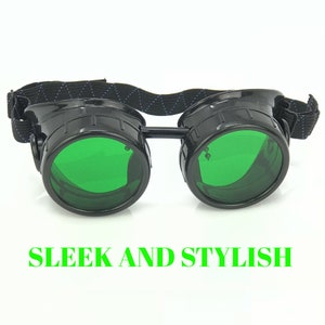 May include: Black steampunk goggles with green lenses and a black adjustable strap. The goggles have a sleek and stylish design.