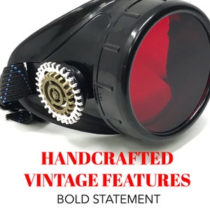 May include: Black steampunk goggles with red lenses and a decorative gear on the side. HANDCRAFTED VINTAGE FEATURES BOLD STATEMENT.