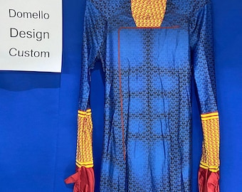 May include: A blue and yellow patterned bodysuit with red gloves. The bodysuit has a high neck and long sleeves. The text "Domello Design Custom" is on a white sign.