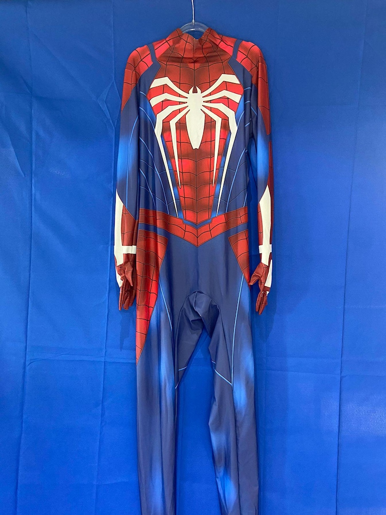 May include: A red and blue spandex Spider-Man costume with a white spider logo on the chest. The costume has a zipper in the back and is designed to look like the Spider-Man suit from the video game.