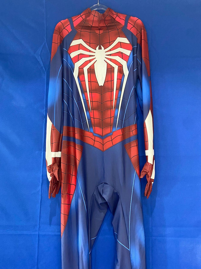 May include: A blue and red spandex Spider-Man costume with a white spider logo on the chest. The costume has a zipper in the back and a hood.