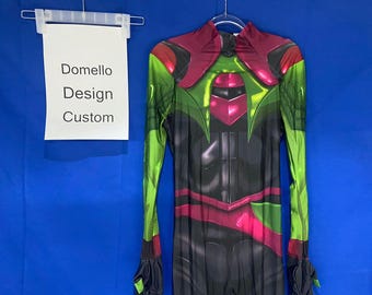 May include: A black, green, and pink bodysuit with a graphic print of a superhero. The bodysuit has long sleeves and a high neck. The text "Domello Design Custom" is printed on a white sign behind the bodysuit.
