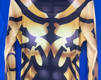 May include: Black and gold long-sleeved bodysuit with a geometric pattern.