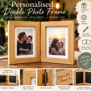 May include: A light brown wooden double photo frame with a hinged design that opens like a book. The frame features a natural wood grain finish, metal hinges, and a white mat border. It includes space for two vertical photographs and custom engraving.