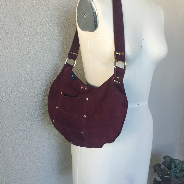 Red Suede Mid Size Shoulder Bag In Burgundy Red With Gold Riveting Detail Pocket Zip Closure. Lined In Golden Thai Fabric & Zip Pocket. 80’s