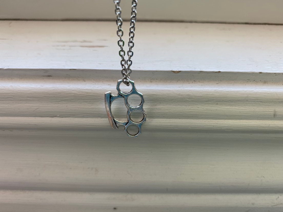 Brass knuckles sale necklace hot topic