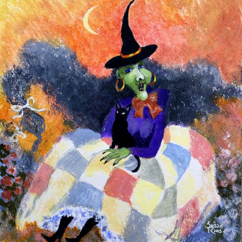 May include: A painting of a green-skinned witch wearing a black pointed hat and a purple top with a red bow, holding a black cat. The witch sits under a crescent moon against an orange sky, covered by a multi-colored patchwork quilt.