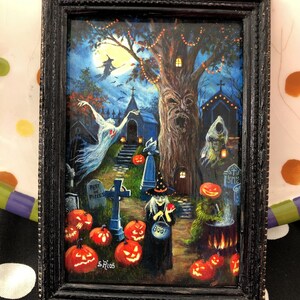 May include: A framed painting of a spooky Halloween scene with a witch, a graveyard, and jack-o'-lanterns. The painting is set against a dark blue background with a full moon in the sky. The witch is wearing a black dress and a pointed hat, and she is holding a cauldron. The graveyard is filled with tombstones and crosses, and there are jack-o'-lanterns scattered throughout the scene. The painting is signed "S. Rios".