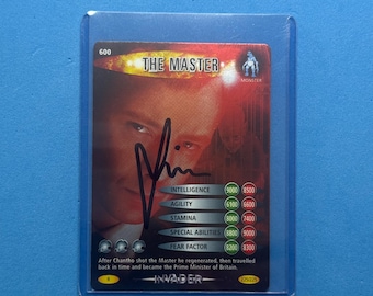 May include: A collectable trading card of "The Master" with a signature. The card displays a portrait and statistics for intelligence, agility, stamina, special abilities, and fear factor. The card is encased in a protective sleeve.