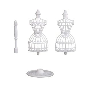 May include: Two white plastic dress forms with a cage-like structure, featuring a vertical support rod and a circular base. The mannequins have a detailed, open-work design with a narrow waist and flared skirt area, presented as separate components.