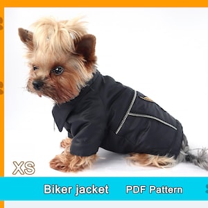 May include: A small dog wearing a black biker jacket with a silver zipper and a small patch on the shoulder. The jacket is labeled "XS" and the text "Biker jacket PDF Pattern" is below the dog.
