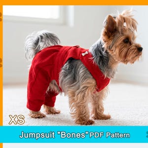 May include: A small dog wearing a red jumpsuit with a bone-shaped button. The jumpsuit covers the dog's legs and torso. The text "XS" is in the lower left corner, and "Jumpsuit "Bones" PDF Pattern" is below the dog.