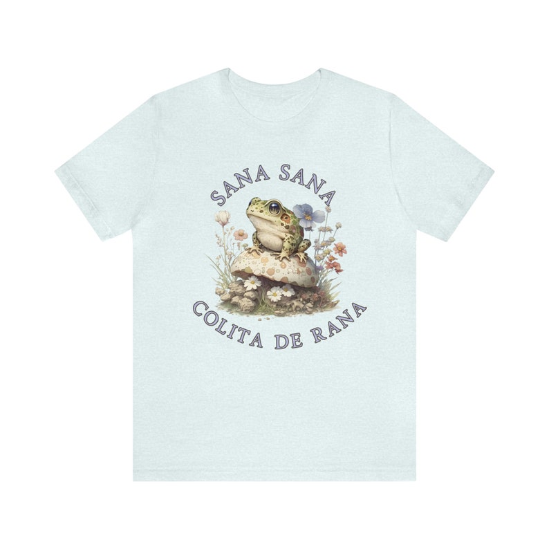 Sana San Colita De Rana Latinx Humor Latina Humor Cottagecore Kidcore Spanish Humor Unisex Jersey Short Sleeve Tee Heather Ice Blue