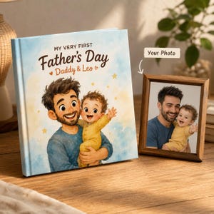May include: A personalized Father's Day book and a framed photo. The book cover features an illustration of a father holding a baby, with the text "My Very First Father's Day" and "Daddy & Leo". The framed photo shows a similar image of a father and baby.