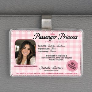 May include: A pink and white gingham patterned Passenger Princess car visor ID card. The card features a photo of a woman, the name Isabella Martinez, and the text "Shotgun Certified, Drive-Thru Director, and Aux Operator."
