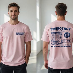 May include: Pink t-shirt with the words "Emergency Department" printed on the front. The back of the shirt features a graphic of a cafe with the words "Emergency Department Code Blue Cafe" and "Open 24/7".