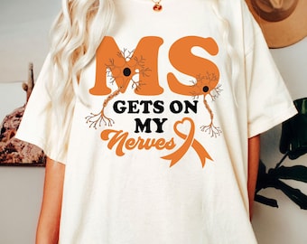 Camiseta de concienciación sobre la esclerosis múltiple, camiseta de la EM me pone de los nervios, camiseta de lazo naranja, camiseta de apoyo a la EM, camiseta de guerrero de la EM, camiseta de superviviente de la EM
