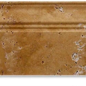 May include: A close-up of a travertine tile with a light brown color and a textured surface. The tile has a raised border with two grooves.