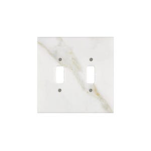 May include: A square, double-switch plate with a white marble design and two toggle switch openings. The marble has subtle gold and tan veining, adding a touch of elegance to the wall plate.