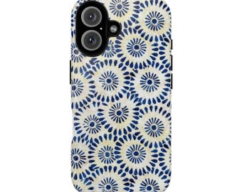 May include: A phone case with a repeating pattern of blue and white floral designs. The case has a camera cutout and black side accents. The floral pattern is a series of concentric circles with a dot pattern.