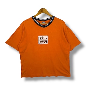 May include: A white ceramic mug with a black handle and the text "But First, Coffee" in a black, handwritten-style font. The mug is on a white surface.