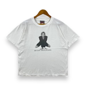 May include: White t-shirt with a black and white photo of a person wearing a black outfit and the text "BUGLE BOY JEANS".
