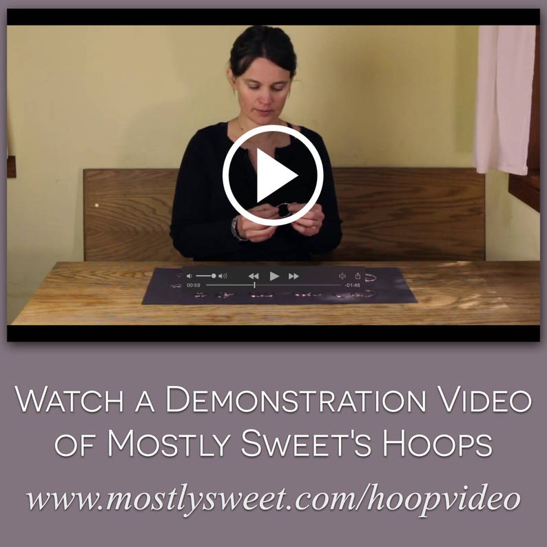 Video thumbnail showing Mostly Sweet Jeweler demonstrating how to put on hoop earrings with play button overlay. Appears to be a tutorial filmed against neutral background at a wooden table. Purple banner at bottom reads "WATCH A DEMONSTRATION VIDEO OF MOSTLY SWEET'S HOOPS" with website URL www.mostlysweet.com/hoopvideo. Instructional content to help customers learn proper technique for wearing endless hoop style earrings.