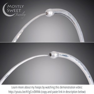 Close-up demonstration of sterling silver hoop earring closure in two stages. Top image shows open clasp with wire ready to insert into hollow tube end. Bottom image shows closed clasp with wire inserted for secure fit. Mostly Sweet Jewelry logo in upper left corner. Text at bottom promotes instructional video with YouTube link. Against neutral gray background showcasing the simple yet secure endless hoop mechanism.