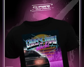 May include: A black t-shirt featuring a graphic print of a sports car rear end with glowing red taillights. The design includes the text "CHRIS'S VIVID VEHICLES" in a stylized font, set against a sunset, lightning bolts, and a digital grid background.