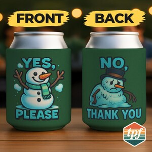 May include: Green can cooler with a snowman graphic. One side says "YES, PLEASE" with a smiling snowman wearing a scarf. The other side says "NO, THANK YOU" with a sad snowman wearing a hat. The top and bottom of the cooler are silver.
