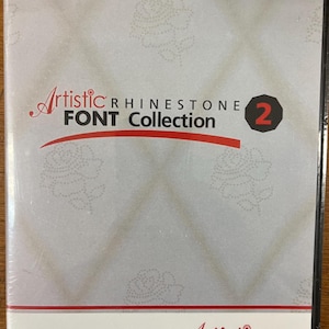May include: A DVD case featuring the text "Artistic Rhinestone Font Collection 2". The cover is white with a red stripe and floral patterns. The Artistic logo and website address are also visible.
