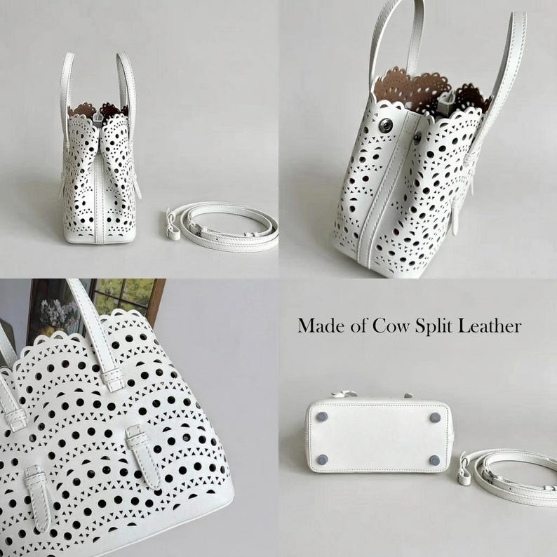 May include: A white leather handbag with a laser-cut design, featuring a top handle and a detachable shoulder strap. The bag has a rectangular base and a scalloped edge. The text "Made of Cow Split Leather" is visible.