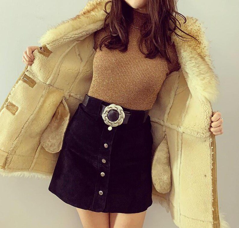 boho Penny Lane coat, women's warm shearling overcoat, Afghan vintage suede coat, timeless brown fur coat, stylish mid-length winter wear, 90s retro fashion coat, handmade boho shearling coat, fur-lined Afghan leather coat, cozy women's trench coat, soft suede mid-length overcoat, elegant bohemian fur coat, warm and luxurious winter coat, fashionable suede leather overcoat, stylish retro-inspired shearling coat, winter wardrobe essential for women, unique handmade coat