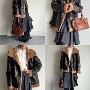 women's shearling bomber, brown aviator coat, sheepskin winter jacket, RAF pilot leather trench, vintage lambskin outerwear, cozy flight coat, handmade bomber jacket, distressed fur collar coat, warm shearling outerwear, WWII B3 bomber jacket, winter leather trench, lambskin flight bomber, women's brown bomber coat, sheepskin trench coat, leather pilot bomber, flight style winter coat, thick warm lambskin, retro shearling fashion, long bomber coat, real fur collar jacket
