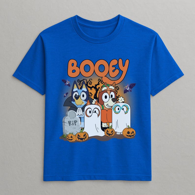 A blue t-shirt with a Halloween-themed graphic design featuring characters such as Booyie, a blue cat, and ghostly figures.