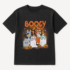 A black t-shirt with a Halloween-themed graphic design featuring characters from the children's television series Booyie.
