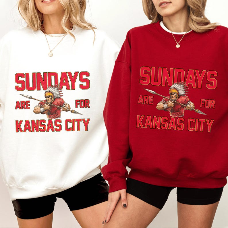 Two women wearing sweatshirts with the text "SUNDAYS ARE FOR KANSAS CITY" printed on them.