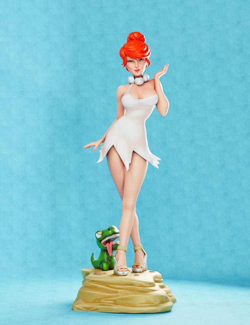 May include: A red-haired woman in a white dress stands on a rock with a green dinosaur figurine. The woman is wearing white heels and has a pearl necklace.