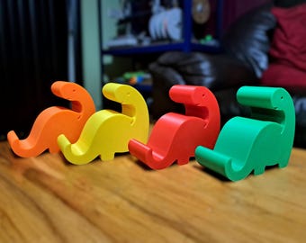 Dinosaur Phone Stand – Cute 3D Printed Dino Phone Holder for iPhone, Android, iPad or Tablet | Fun Desk Dock, Nightstand Buddy, Gift Idea